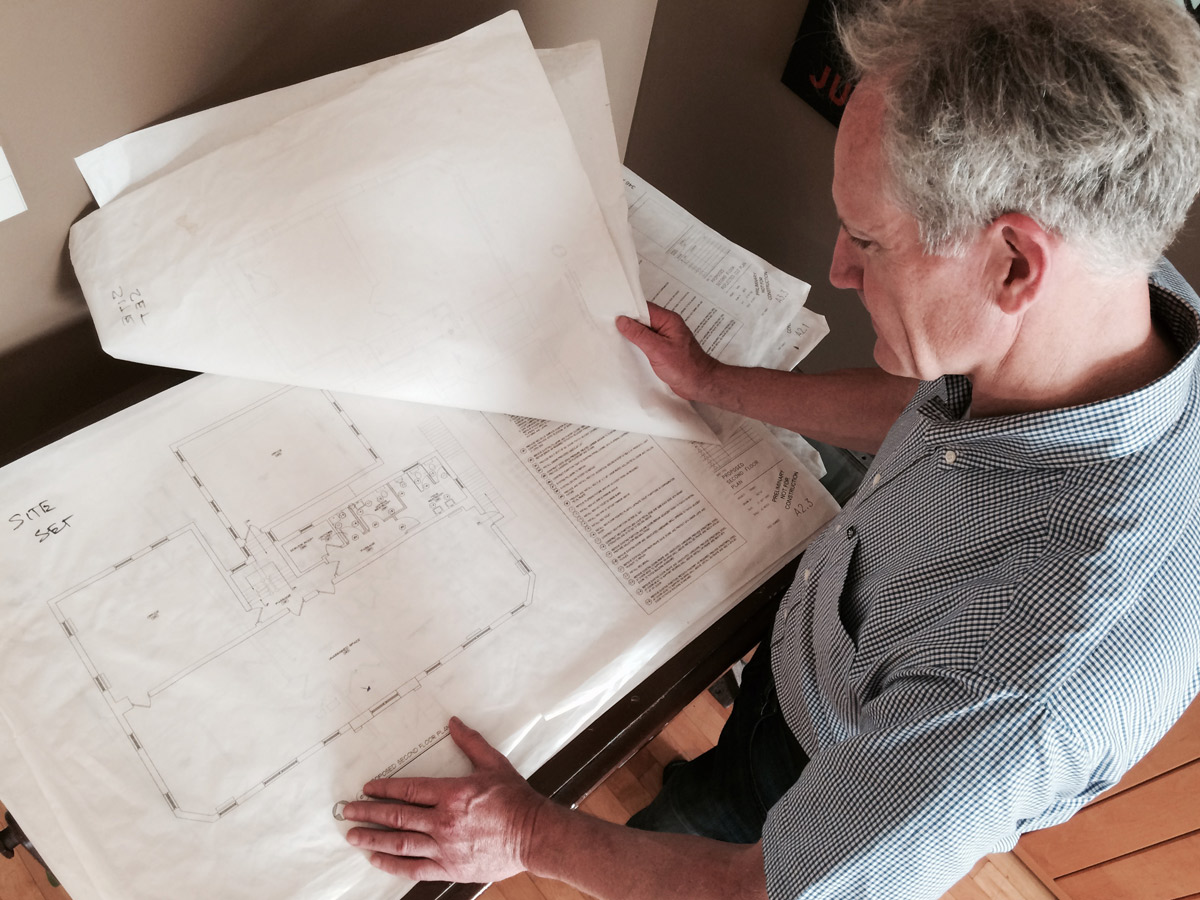 andy reviewing blueprints to create mold remediation plan